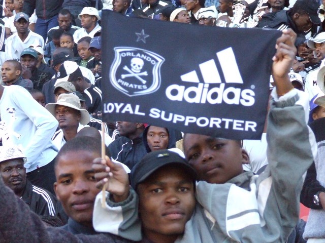 Bucs supporters marking a Pirates victory, black and white colours throughout the arena